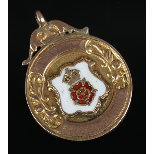 432 - A 9ct gold fob with enamel Lancashire Rose crest inscribed for Holbrook & Dist F.L Junior Winners 19... 