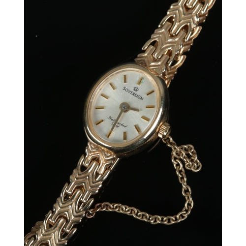 434 - A 9ct gold ladies Sovereign wristwatch with decorative link strap and safety chain. Weight including... 