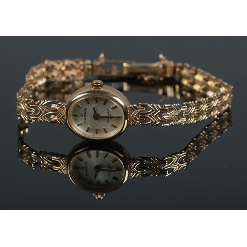 434 - A 9ct gold ladies Sovereign wristwatch with decorative link strap and safety chain. Weight including... 