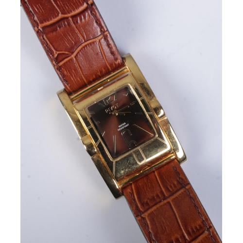 443 - A gents gilt metal Pivot quartz wristwatch, with reversible watch head. On original strap.