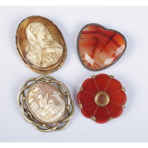 457 - Four large antique brooches. Includes cameo and stone examples.