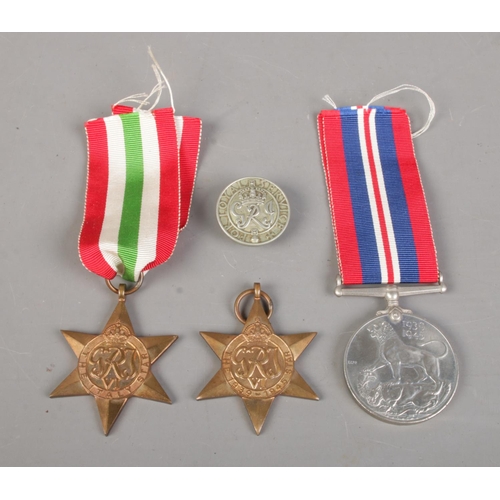 460 - Three WWII medals, including 1939-45 medal, The Italy Star and 1939-45 Star, together with a George ... 