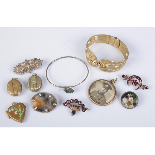 462 - A collection of antique jewellery. Includes moss agate brooch, gilt metal bangle, lockets etc.