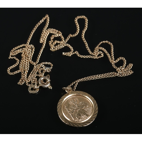 483 - A 9ct gold St Christopher on 9ct gold chain. 3.4g.