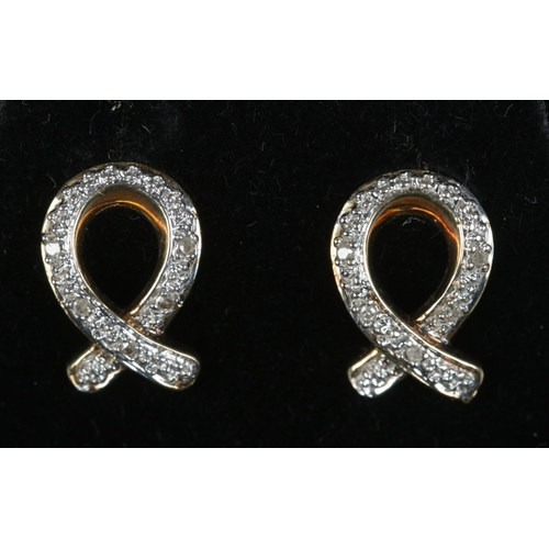 492 - A pair of 9ct gold and diamond knot earrings. 1.8g.