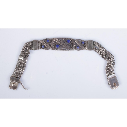 497 - A silver bracelet with decorative filigree, Greek key and chain link detail. Approx. weight 22.9g.