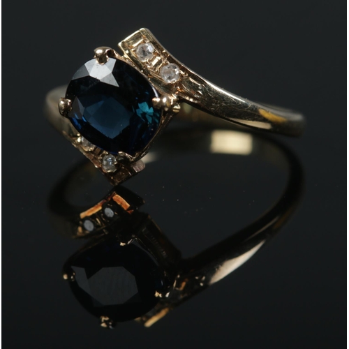 498 - A 14ct gold, sapphire and diamond ring. Size M. 2.8g.