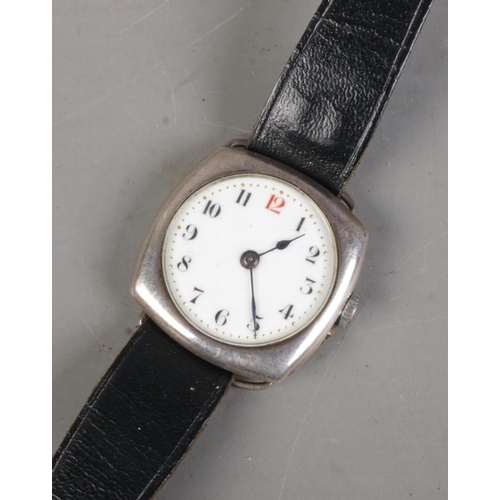 505 - A men's silver cased automatic wrist watch on leather strap. Features gilt detailing to face and mak... 