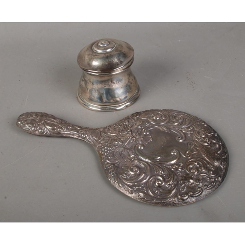 528 - Two pieces of silver to include silver handled mirror (Birmingham 1911) and lidded pot (London 1902,... 