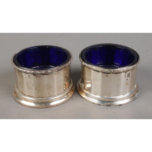 542 - A pair of William Neale & Son Ltd silver salts with Bristol blue liners. Dated 1938 and 1939. Approx... 