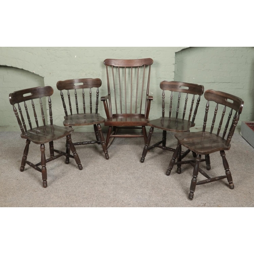 564 - A set of four tavern chairs along with a spindle back rocking chair.