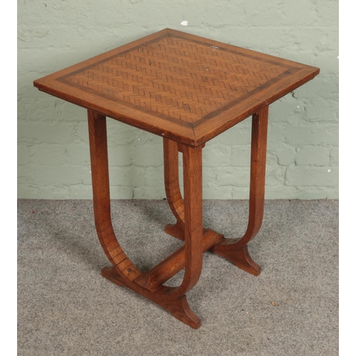 570 - A French oak Art Deco style side table with parquetry design to top.

Hx69cm
Wx55cm
Dx55cm