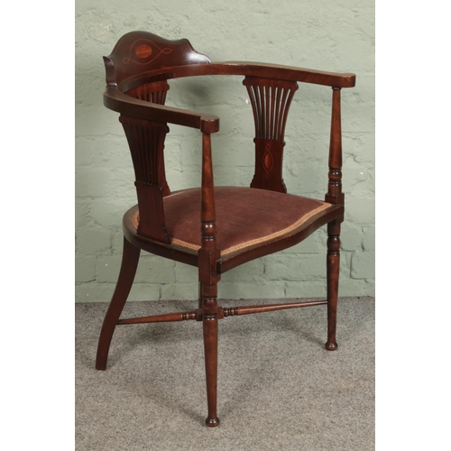 573 - An early 20th century mahogany inlaid armchair