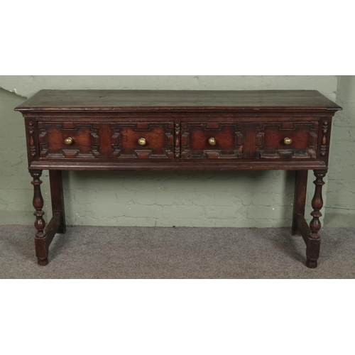 592 - A 17th Century style oak geometric moulded dresser base/sideboard  by Thomas Clarkson & Sons Wolverh... 