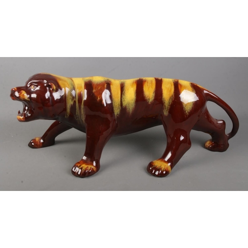 133 - A large Blue Mountain Pottery tiger in the harvest gold design.

Length 60cm approx