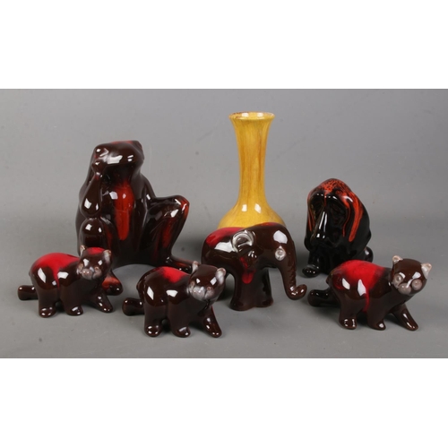 136 - A collection of Blue Mountain Pottery in the red and harvest gold design including large frog, dog, ... 