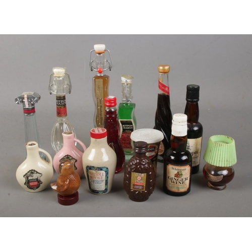 154 - A collection of assorted alcohol miniatures to include cherry ardo, coffee liquor, ginger cordial Pu... 