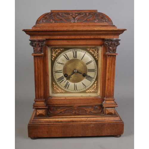 174 - A German mantel clock in an oak case manufactured by HAC (Hamberg American Clock Company) with arts ... 