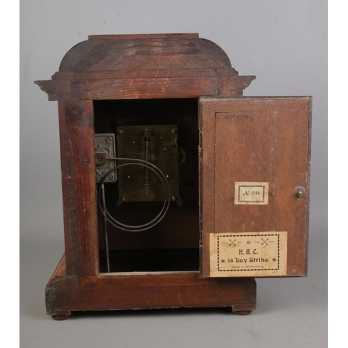 174 - A German mantel clock in an oak case manufactured by HAC (Hamberg American Clock Company) with arts ... 