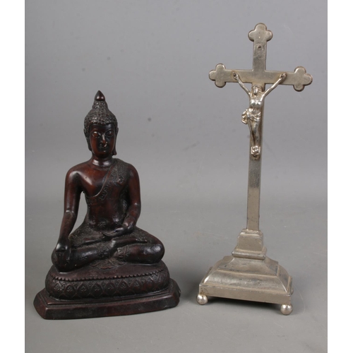 183 - A metal crucifix along with composite Buddha