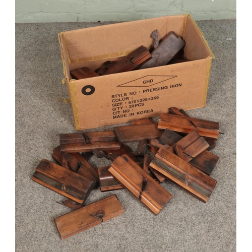 241 - A box of assorted wood working planes including examples stamped by S Copley, H Lockwood, G Coulters... 