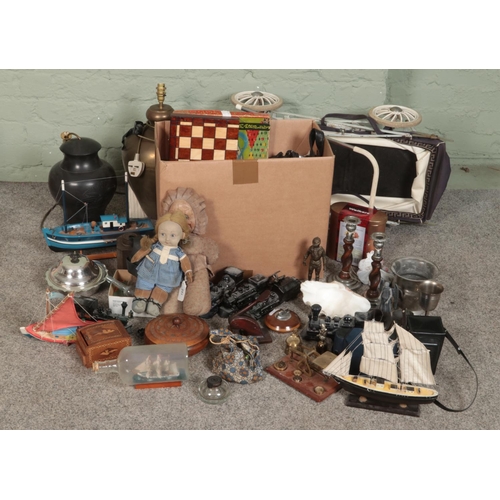 245 - A box of mixed collectable including a selection of vintage board games, leather satchels, carved wo... 