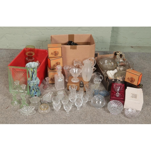 246 - A large quantity of cut glass including trinket boxes, jugs, bowls, wine glasses, figures, vases tog... 