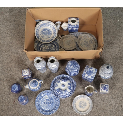 247 - A box of blue and white ceramics including ginger jars, tea pots, vases and plates. Including exampl... 