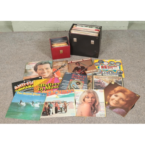 253 - A collection of records in travel case including Beach Boys, Jim Reeves, Benny Hill, Johnny Cash, Ke... 