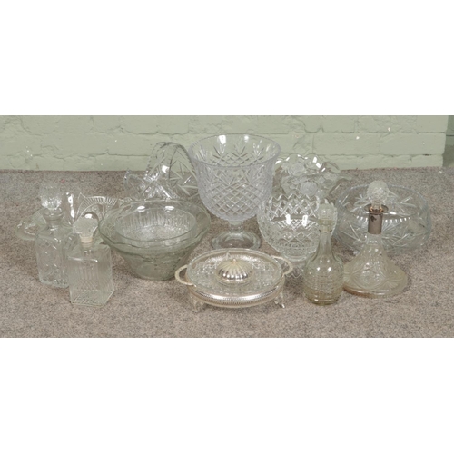 278 - A large quantity of cut glass items including large centre piece bowl, fruit bowls, decanters, hors ... 