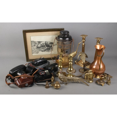 285 - A quantity of mixed collectables including a Tilley lamp, various metal wares including brass candle... 