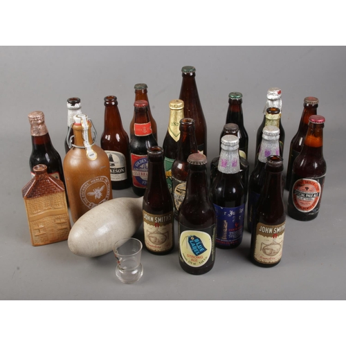 304 - A collection of brewery and other advertising bottles including Brakspears, Silver Jubilee and royal... 