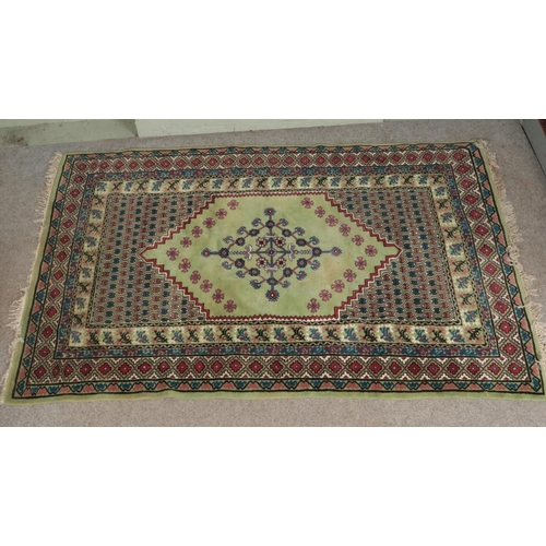 342 - A large green wool rug 

190x280cm