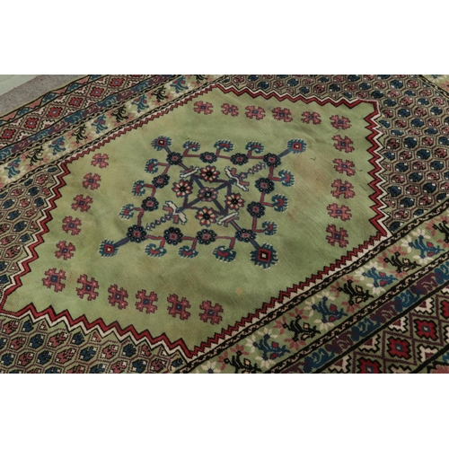 342 - A large green wool rug 

190x280cm