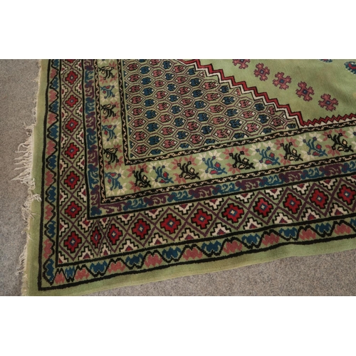 342 - A large green wool rug 

190x280cm