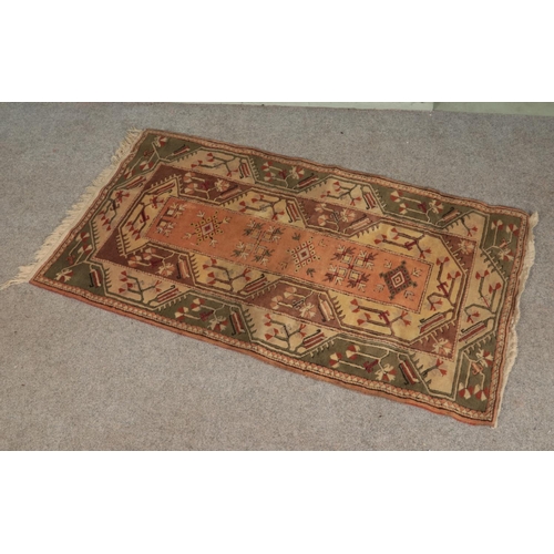 344 - A wool rug with Aztec style pattern.

200x114cm