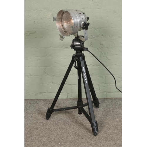 348 - A studio light on a IQ video 300v camera stand.