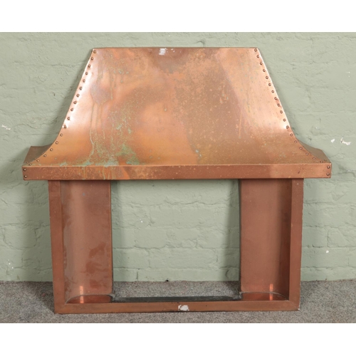 396 - A vintage copper fire surround and canopy.