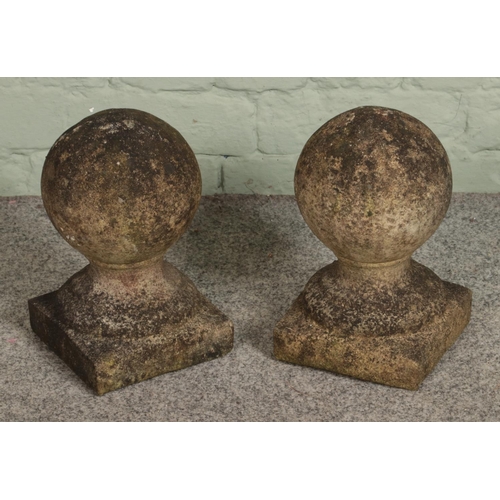 397 - Two 20th century ornamental concrete garden balls.

Hx28cm