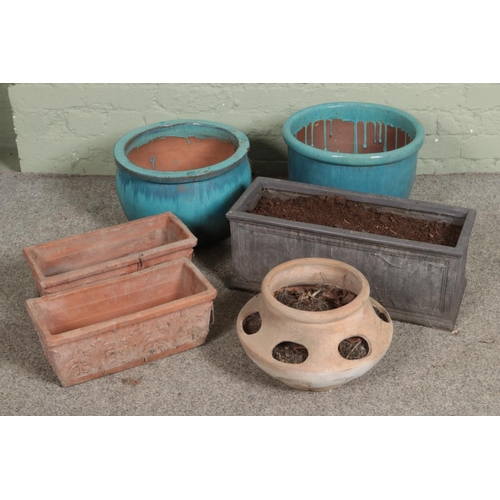 399 - A quantity of garden pots and planters including blue glaze examples.