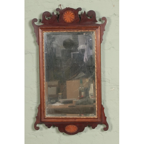 423 - A mahogany inlaid regency style wall mirror with bevelled edge glass

Hx67cm