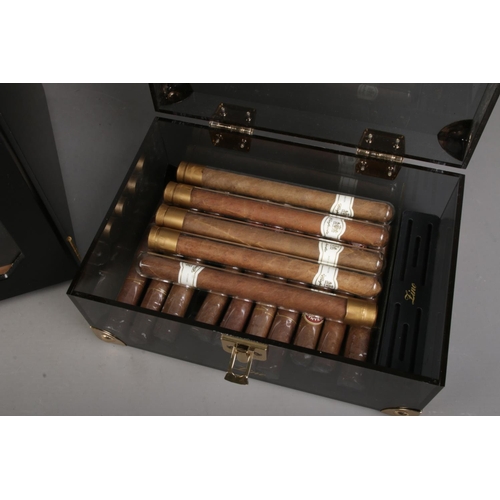 81 - A small matt black humidor by Adorini, can hold up to 100 cigars divided into 3 drawers with a hair ... 