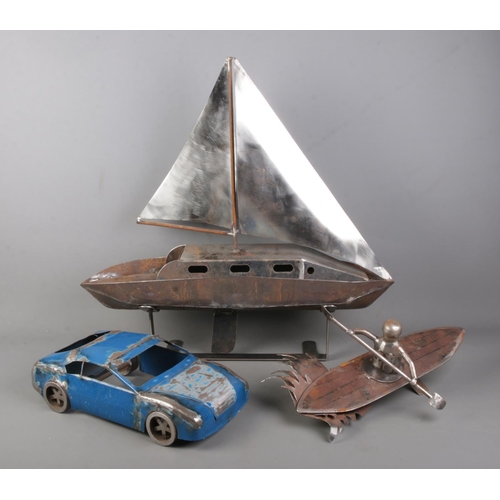 84 - A collection of scratch built metal salvage models including sailing boat, speed boat and car.