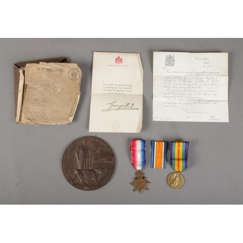 523 - A World War One bronze memorial plaque/death penny awarded to Charles Harold Rumley in original box ... 