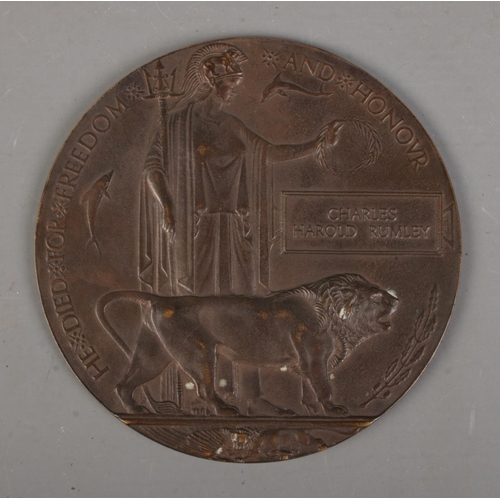 523 - A World War One bronze memorial plaque/death penny awarded to Charles Harold Rumley in original box ... 