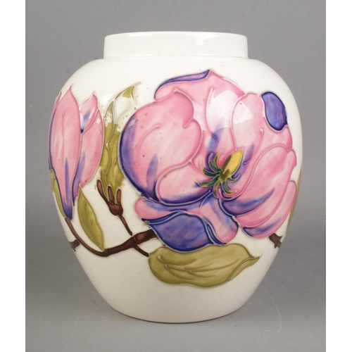 534 - A Moorcroft Magnolia design on ivory background.

Hx18cm