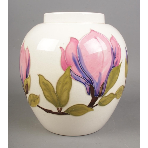 534 - A Moorcroft Magnolia design on ivory background.

Hx18cm