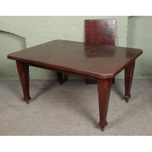 550 - A rectangular mahogany extending dining table with square tapering legs raised on castors.

Hx74cm
W... 