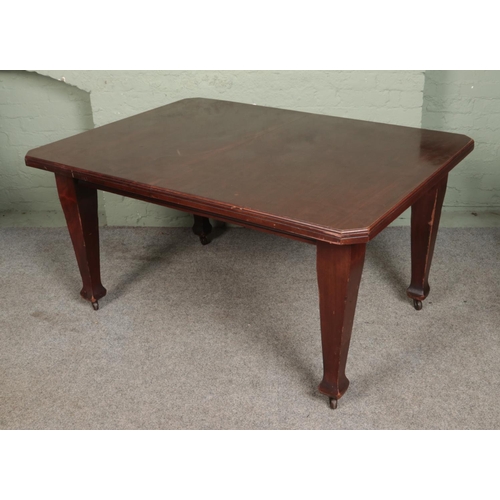 550 - A rectangular mahogany extending dining table with square tapering legs raised on castors.

Hx74cm
W... 