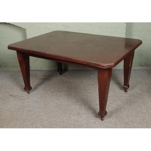 550 - A rectangular mahogany extending dining table with square tapering legs raised on castors.

Hx74cm
W... 